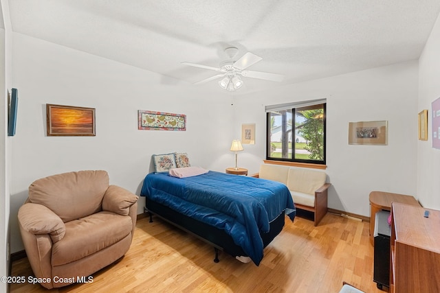 1875 Halifax Ave, Melbourne, FL 32935 - bedroom with light wood-type flooring, baseboards, and a ceiling fan