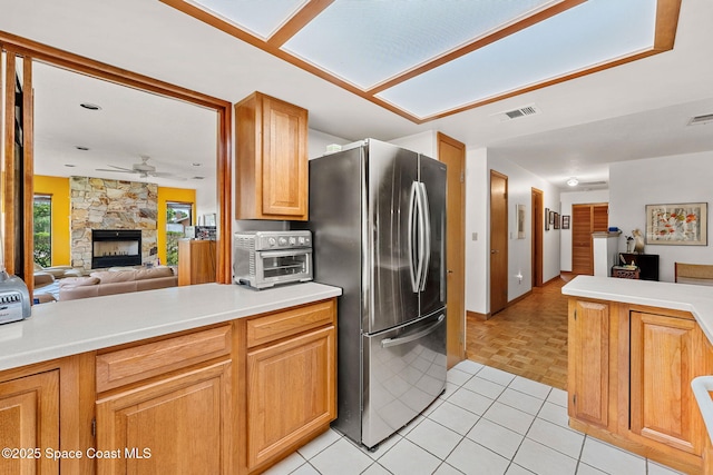 1875 Halifax Ave, Melbourne, FL 32935 - kitchen featuring freestanding refrigerator, open floor plan, a ceiling fan, and light countertops