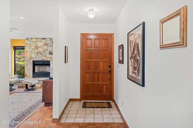 1875 Halifax Ave, Melbourne, FL 32935 - entrance foyer featuring baseboards and a stone fireplace