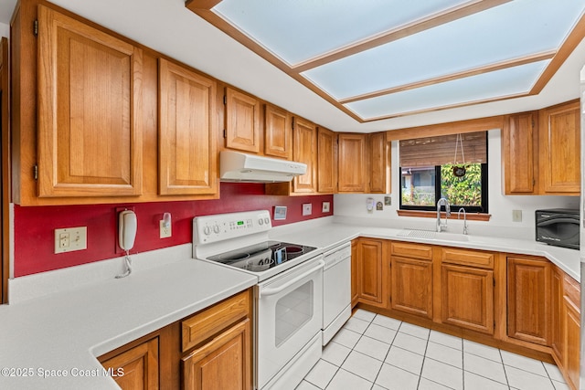 1875 Halifax Ave, Melbourne, FL 32935 - kitchen featuring white appliances, under cabinet range hood, a sink, light tile patterned floors, and brown cabinets