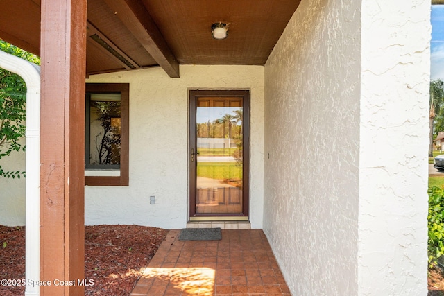 1875 Halifax Ave, Melbourne, FL 32935 - doorway to property featuring stucco siding