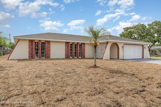 790 Aragon Ave NE, Palm Bay, FL 32905 - ranch-style house featuring a garage, driveway, and a front lawn