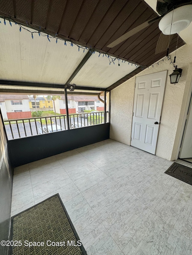 624 Ridge Club Dr Unit 86, Melbourne, FL 32934 - unfurnished sunroom featuring a ceiling fan