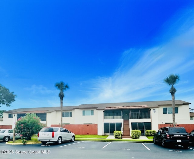 624 Ridge Club Dr Unit 86, Melbourne, FL 32934 - view of property featuring uncovered parking