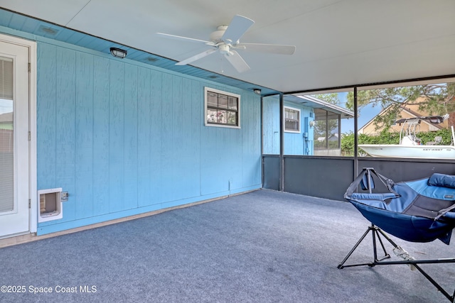 sunroom / solarium with ceiling fan