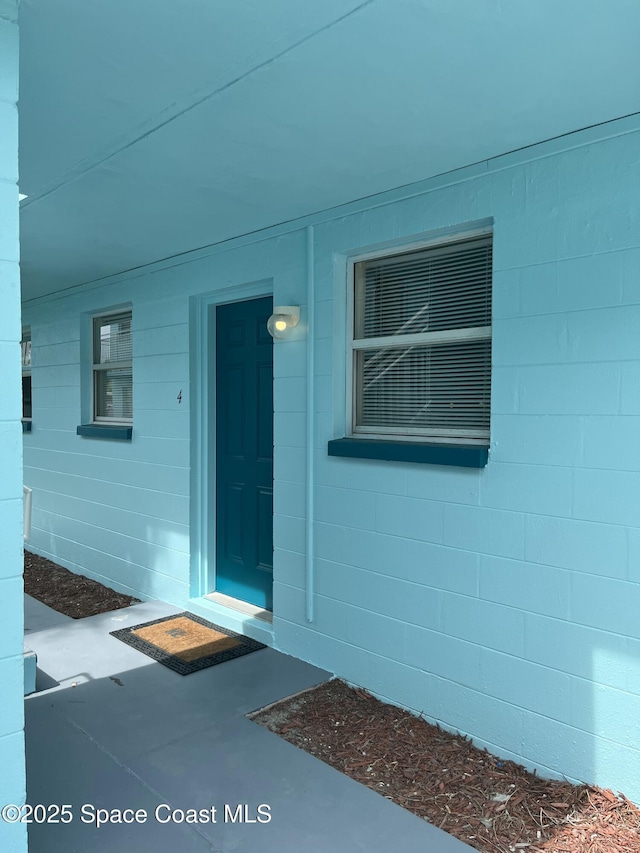 406 Tyler Ave Unit 4, Cape Canaveral, FL 32920 - property entrance with concrete block siding