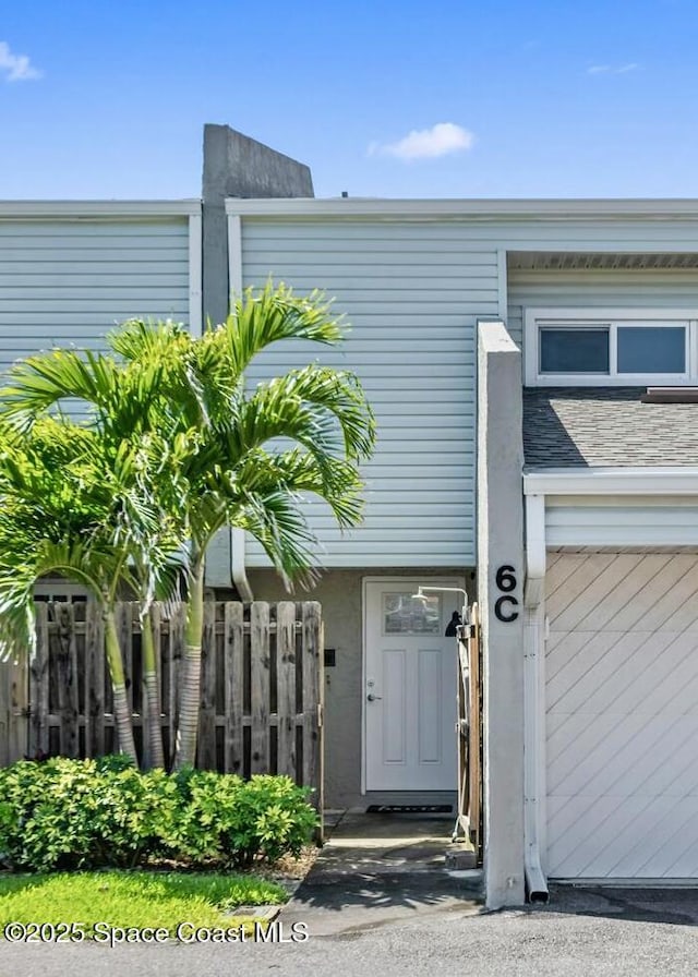 property entrance featuring fence