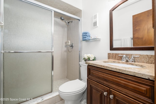9020 Brighton Ct Unit 4-H, West Melbourne, FL 32904 - bathroom featuring a shower stall, toilet, and vanity