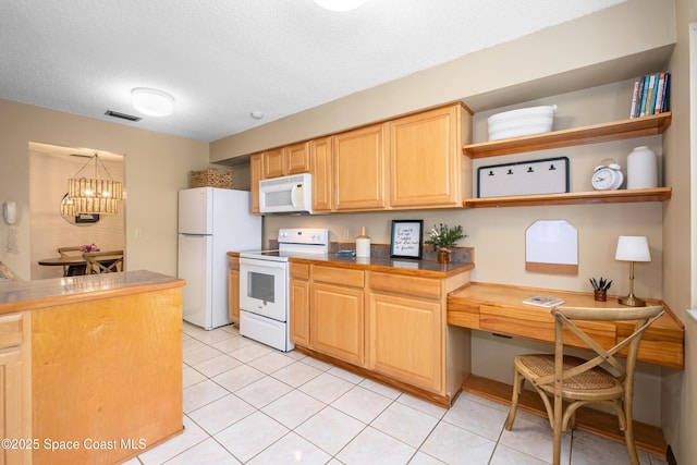 9020 Brighton Ct Unit 4-H, West Melbourne, FL 32904 - kitchen with white appliances, open shelves, a chandelier, dark countertops, and light tile patterned floors