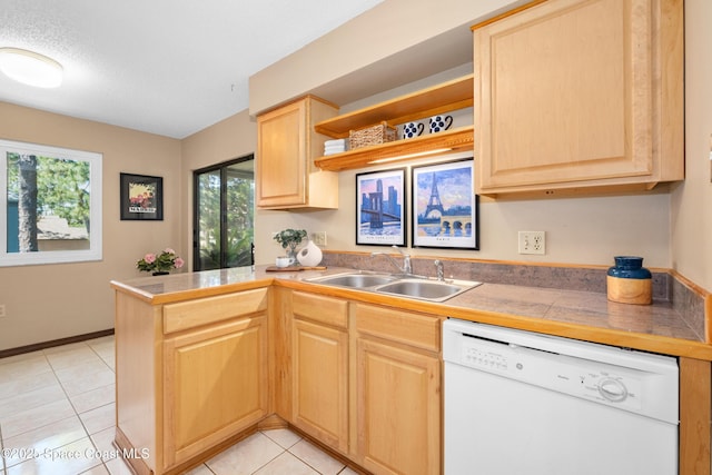 9020 Brighton Ct Unit 4-H, West Melbourne, FL 32904 - kitchen with white dishwasher, light brown cabinetry, a sink, and healthy amount of natural light