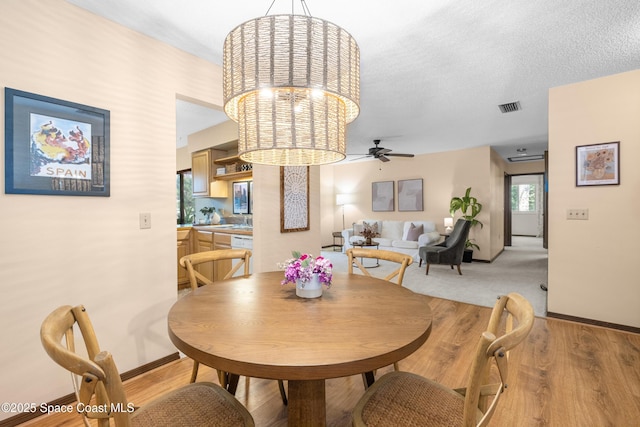 9020 Brighton Ct Unit 4-H, West Melbourne, FL 32904 - dining space with a ceiling fan, baseboards, and light wood-style floors