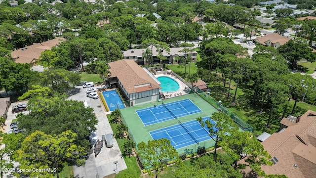 9020 Brighton Ct Unit 4-H, West Melbourne, FL 32904 - aerial perspective of suburban area featuring a pool area and a tree filled landscape