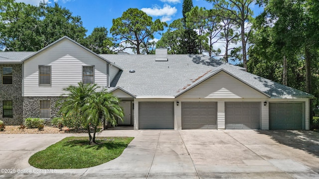 9020 Brighton Ct Unit 4-H, West Melbourne, FL 32904 - townhome / multi-family property featuring concrete driveway, a chimney, a shingled roof, and a garage