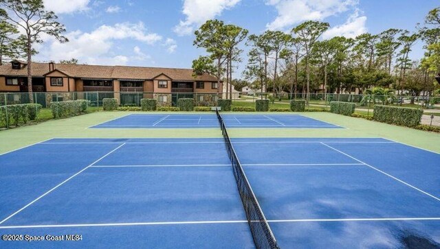 9020 Brighton Ct Unit 4-H, West Melbourne, FL 32904 - view of tennis court featuring fence and community basketball court