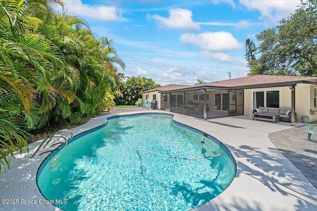 515 Hibiscus Trl, Melbourne Beach, FL 32951 - swimming pool with outdoor lounge area, a sunroom, and a patio