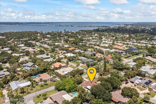 515 Hibiscus Trl, Melbourne Beach, FL 32951 - aerial overview of property's location with a large body of water, nearby suburban area, and a notable bridge