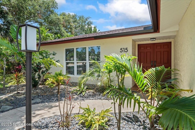 515 Hibiscus Trl, Melbourne Beach, FL 32951 - view of side of home featuring stucco siding