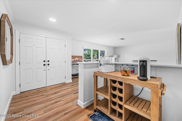 515 Hibiscus Trl, Melbourne Beach, FL 32951 - foyer with light wood finished floors, baseboards, ornamental molding, and recessed lighting