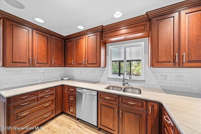 515 Hibiscus Trl, Melbourne Beach, FL 32951 - kitchen featuring stainless steel dishwasher, a sink, tasteful backsplash, light wood-style floors, and recessed lighting