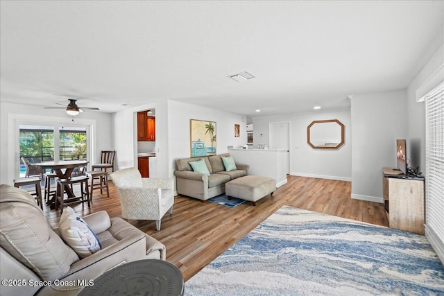515 Hibiscus Trl, Melbourne Beach, FL 32951 - living room featuring light wood-style flooring, ceiling fan, baseboards, and recessed lighting