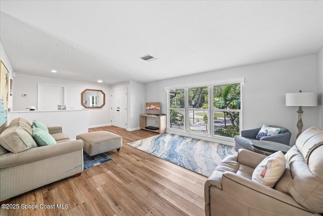 515 Hibiscus Trl, Melbourne Beach, FL 32951 - living room with recessed lighting, wood finished floors, and baseboards
