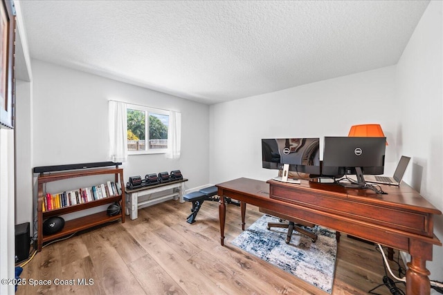 515 Hibiscus Trl, Melbourne Beach, FL 32951 - home office featuring a textured ceiling and wood finished floors