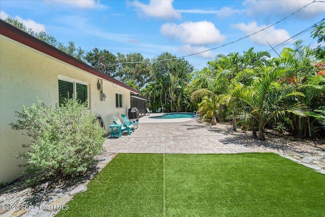 515 Hibiscus Trl, Melbourne Beach, FL 32951 - view of green lawn featuring a patio area and an outdoor pool