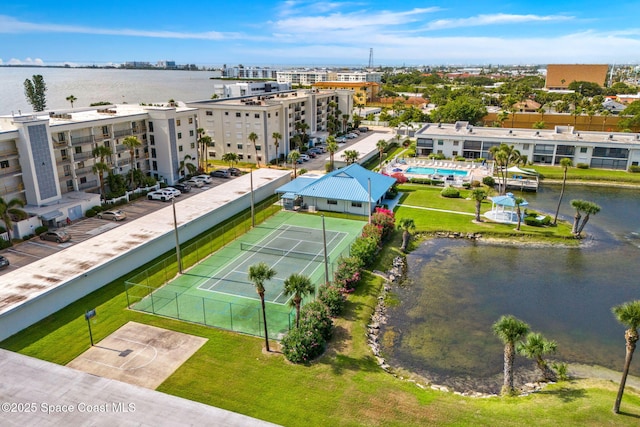 bird's eye view of a large body of water and a pool area