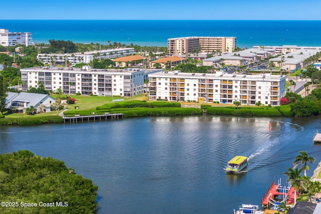 bird's eye view of a large body of water and apartment complex / building