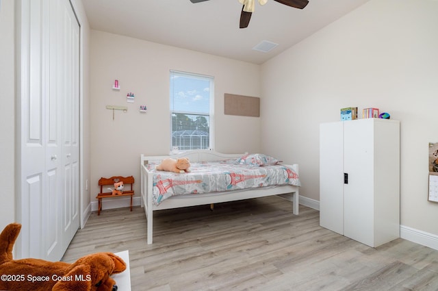 2602 Flintstone Ave SE, Palm Bay, FL 32909 - bedroom with light wood-style flooring, ceiling fan, baseboards, and a closet