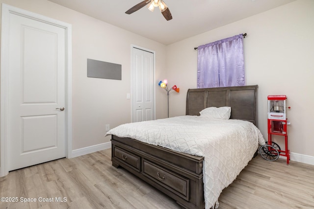2602 Flintstone Ave SE, Palm Bay, FL 32909 - bedroom featuring baseboards, light wood finished floors, a closet, and ceiling fan