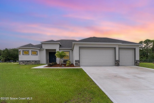 2602 Flintstone Ave SE, Palm Bay, FL 32909 - prairie-style home with an attached garage, stucco siding, concrete driveway, and a lawn