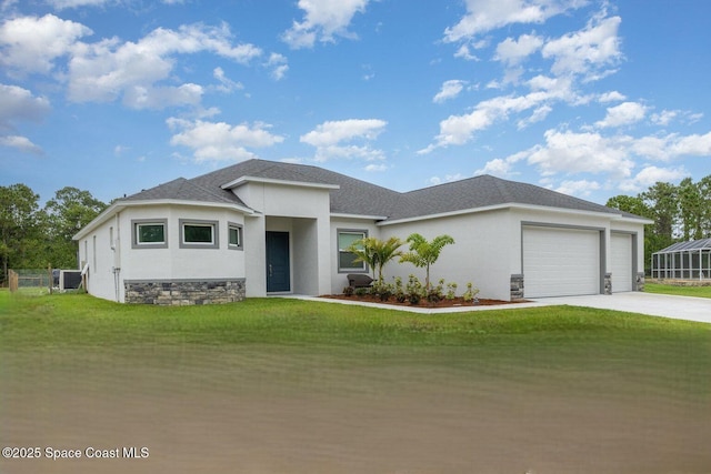 2602 Flintstone Ave SE, Palm Bay, FL 32909 - prairie-style home with an attached garage, stucco siding, driveway, a front lawn, and central air condition unit