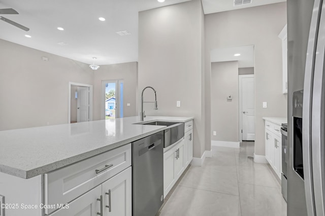 926 Sareta St SE, Palm Bay, FL 32909 - kitchen with appliances with stainless steel finishes, white cabinetry, a ceiling fan, and recessed lighting