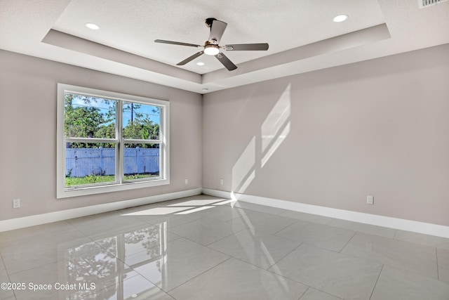 926 Sareta St SE, Palm Bay, FL 32909 - spare room with a raised ceiling, baseboards, ceiling fan, and recessed lighting
