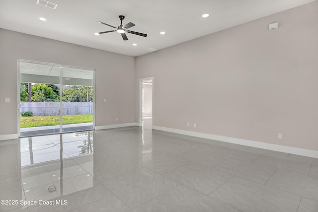 926 Sareta St SE, Palm Bay, FL 32909 - unfurnished room with a ceiling fan, baseboards, recessed lighting, and light tile patterned floors