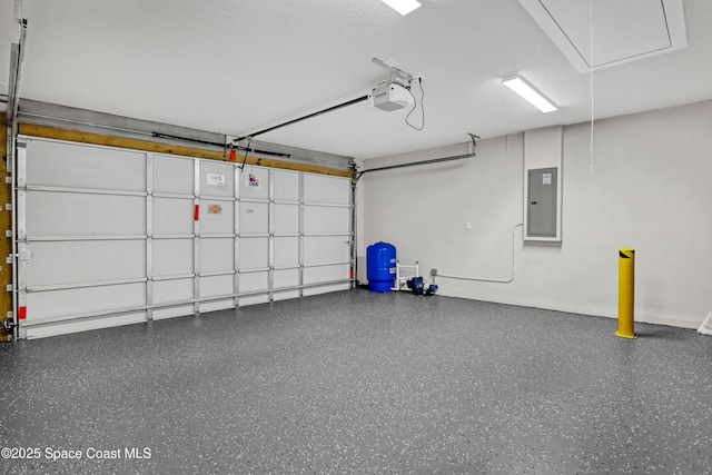 926 Sareta St SE, Palm Bay, FL 32909 - garage featuring electric panel and a garage door opener