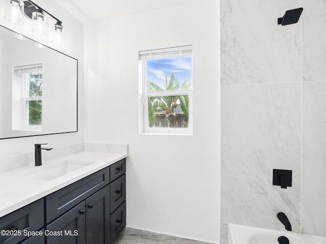 full bathroom with healthy amount of natural light, a shower, vanity, and a tub to relax in