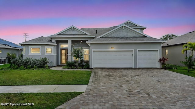 2737 Kilns Cir, West Melbourne, FL 32904 - view of front of property featuring stucco siding, decorative driveway, and a lawn