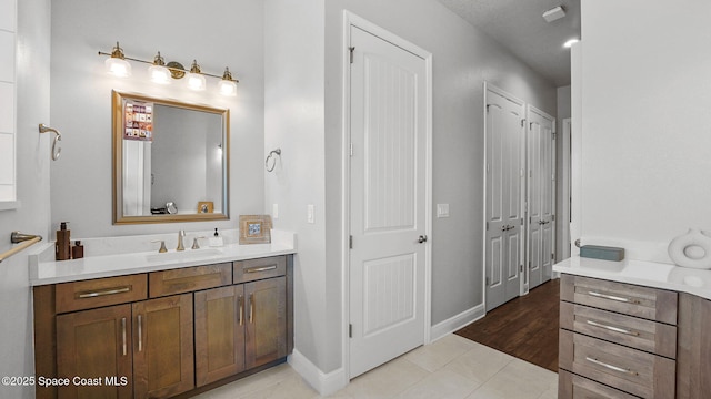 2737 Kilns Cir, West Melbourne, FL 32904 - bathroom with vanity, tile patterned flooring, and baseboards