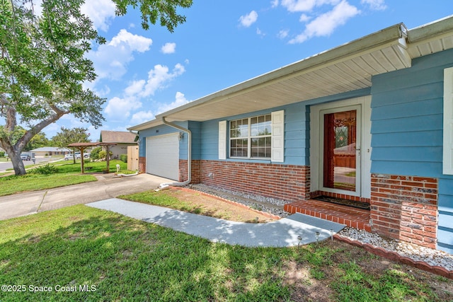 3845 Spring Creek Ln, Titusville, FL 32780 - view of front of property featuring brick siding, driveway, an attached garage, and a front lawn
