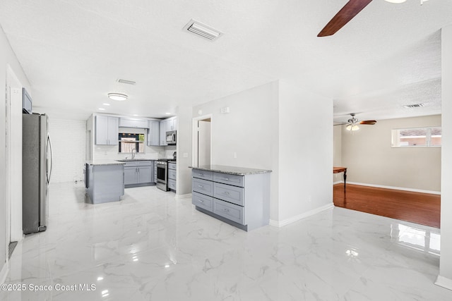 3845 Spring Creek Ln, Titusville, FL 32780 - unfurnished living room with ceiling fan, light marble finish floors, and a textured ceiling