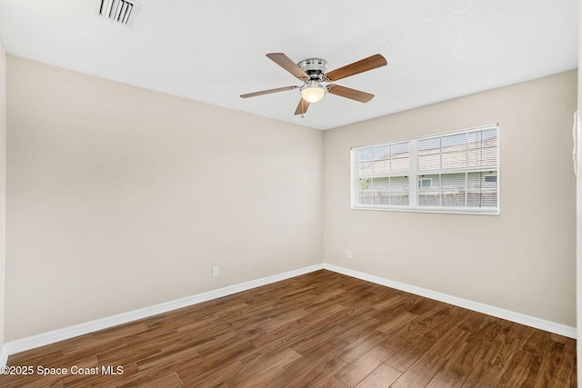 3845 Spring Creek Ln, Titusville, FL 32780 - unfurnished room with wood finished floors and a ceiling fan