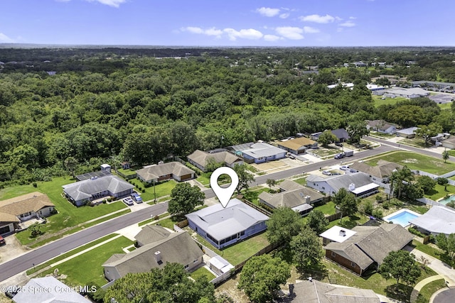 3845 Spring Creek Ln, Titusville, FL 32780 - aerial view of residential area featuring a heavily wooded area