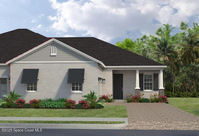 2699 Avalonia Dr, Melbourne, FL 32940 - view of front of property with a front yard, stucco siding, and roof with shingles