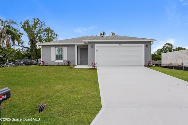 1610 Yahner St SE, Palm Bay, FL 32909 - view of front of home featuring a garage, stucco siding, driveway, and a front yard