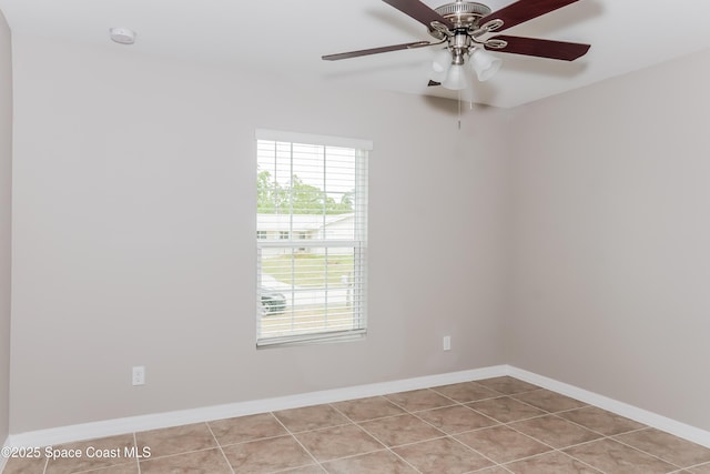 1610 Yahner St SE, Palm Bay, FL 32909 - unfurnished room featuring ceiling fan, tile patterned floors, baseboards, and a smoke detector