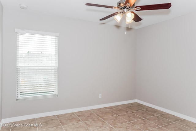 1610 Yahner St SE, Palm Bay, FL 32909 - empty room with a ceiling fan, tile patterned flooring, baseboards, and a smoke detector