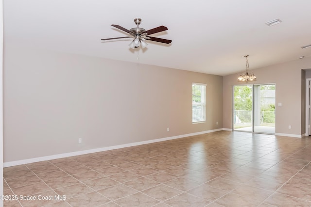 1610 Yahner St SE, Palm Bay, FL 32909 - unfurnished room with a chandelier, ceiling fan, baseboards, and light tile patterned flooring
