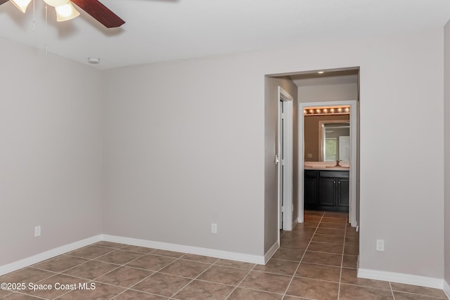 1610 Yahner St SE, Palm Bay, FL 32909 - tiled empty room with a ceiling fan, baseboards, and a smoke detector